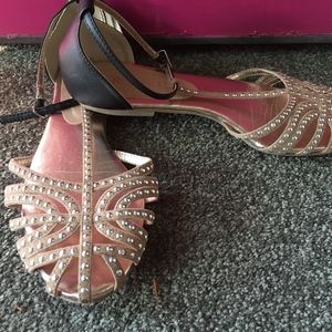 Tan and Black flat sandals with decorative studs